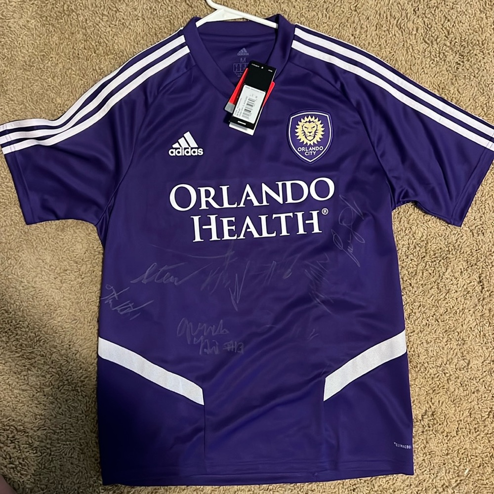 New with tags and signed Orlando City jersey